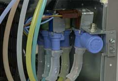 Oregon Appliance Repair installs inlet valve in a fridge.